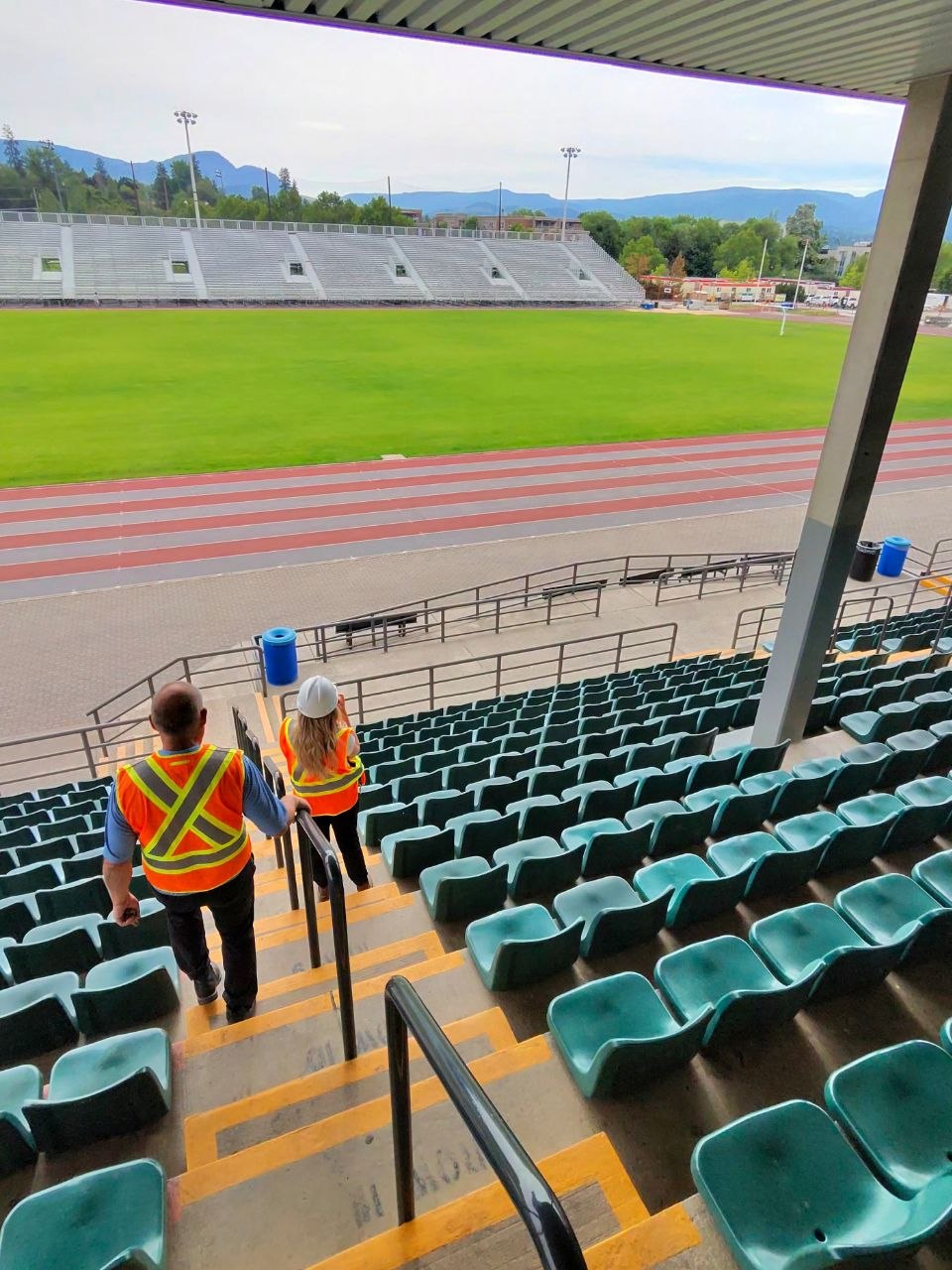 Site walk in the Apple Bowl seating area during Touchdown Kelowna network planning