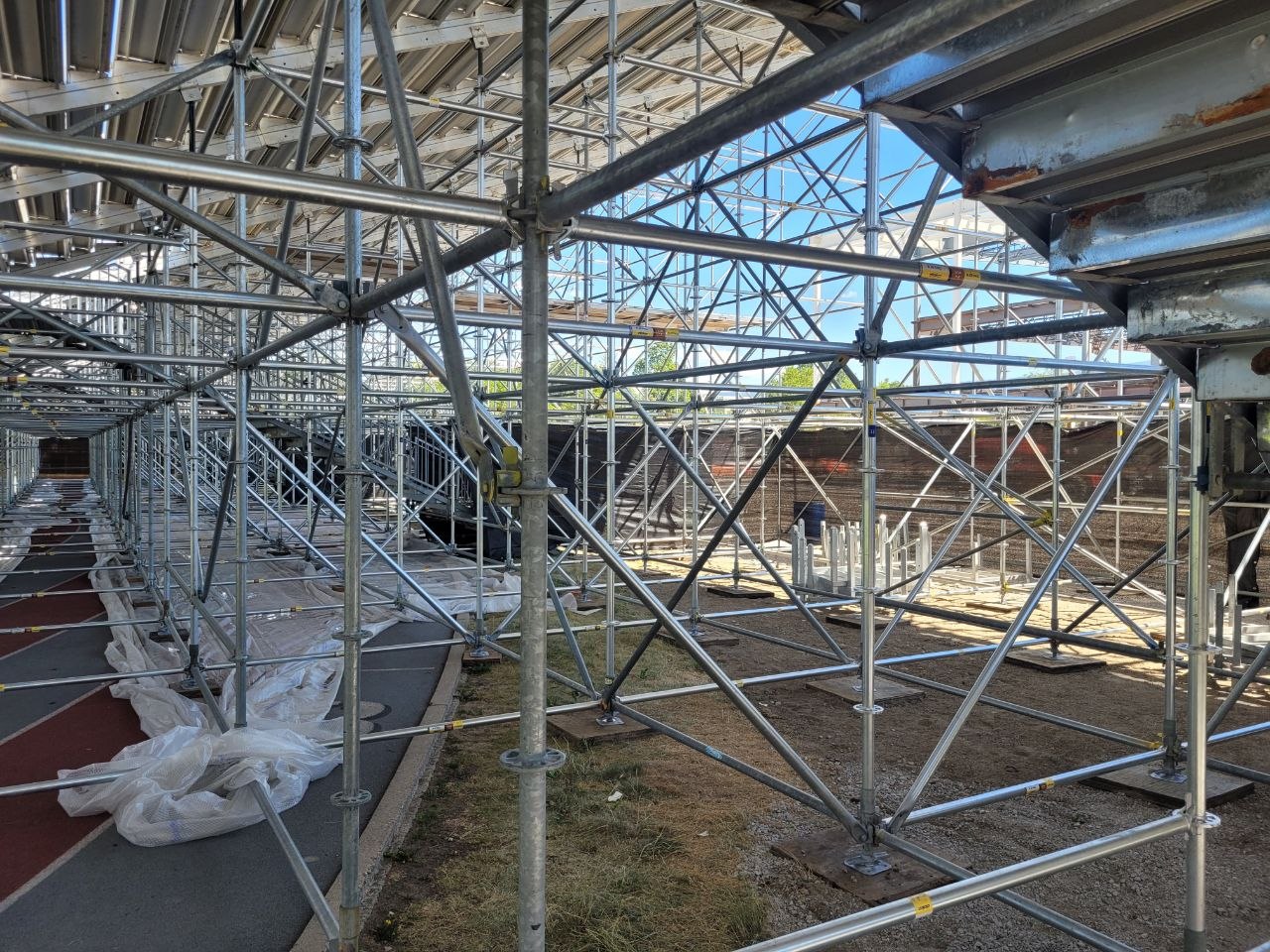 Under-bleacher steel structure at the Apple Bowl used for temporary cable routing